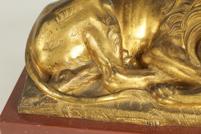 Lot 698 - A PAIR OF LATE 19TH CENTURY GILT BRONZE RECUMBENT LIONS