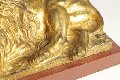 Lot 698 - A PAIR OF LATE 19TH CENTURY GILT BRONZE RECUMBENT LIONS