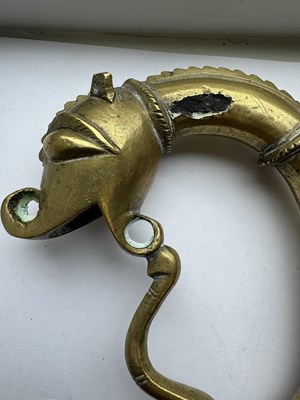 Lot 816 - A 19TH CENTURY INDIAN RAJPUT BRONZE SWORD HILT