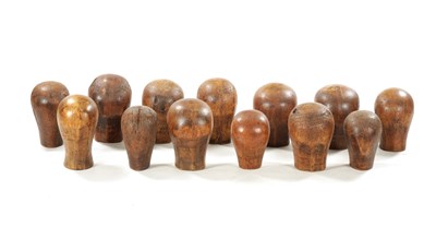 Lot 965 - A COLLECTION OF THIRTEEN 19TH CENTURY WOODEN WIG STANDS