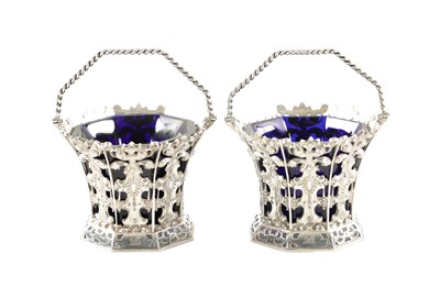 Lot 699 - A PAIR OF MID 19TH CENTURY SILVER SWEET BASKETS