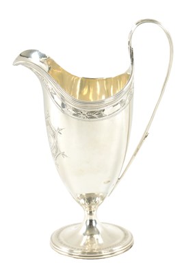 Lot 696 - A GEORGE III HELMET STYLE SILVER CREAM JUG