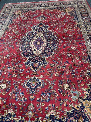 Lot 1460 - A LARGE EASTERN RUG