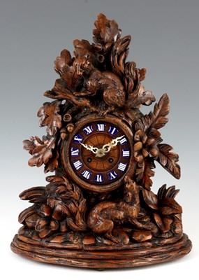 Lot 648 - A 19th CENTURY CARVED WALNUT BLACK FOREST...