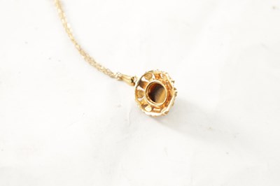 Lot 276 - A 9CT GOLD PENDANT NECKLACE WITH CABOCHON TIGER EYE