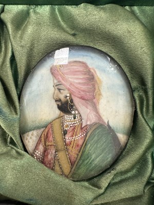 Lot 276 - A CASE GROUP OF NINETEEN PAINTED IVORY MINIATURE PORTRAITS OF THE INDIAN MAHARAJA OF PUNJAB