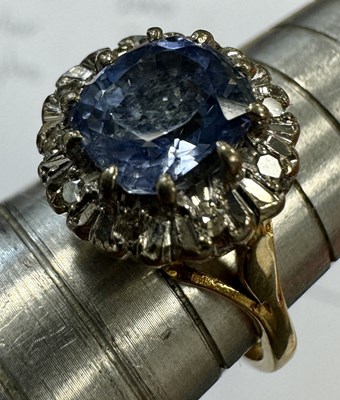 Lot 312 - AN 18CT GOLD SAPPHIRE AND DIAMOND RING AND 9CT GOLD SEVEN STONE RING