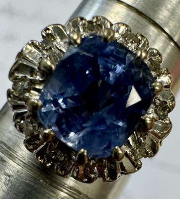 Lot 312 - AN 18CT GOLD SAPPHIRE AND DIAMOND RING AND 9CT GOLD SEVEN STONE RING