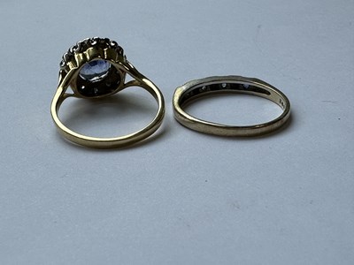 Lot 312 - AN 18CT GOLD SAPPHIRE AND DIAMOND RING AND 9CT GOLD SEVEN STONE RING