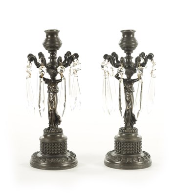 Lot 827 - A PAIR OF 19TH CENTURY REGENCY STYLE BRONZE FIGURAL CANDLESTICKS