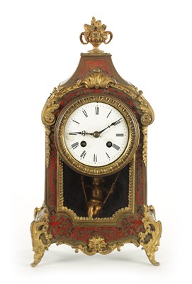 Lot 1050 - A LATE 19TH CENTURY FRENCH BOULLE SWINGING CHERUB MANTEL CLOCK