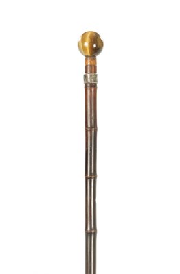 Lot 705 - A LATE 19TH CENTURY BAMBOO AND TIGERS EYE WALKING STICK