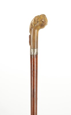 Lot 715 - A LATE 19TH CENTURY CARVED HORN AND MALACCA WALKING STICK