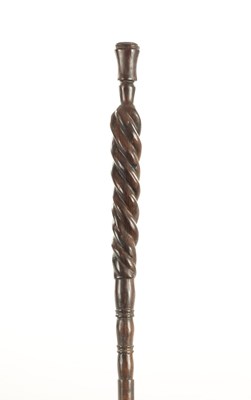 Lot 701 - AN AFRICAN CARVED HARDWOOD WALKING STICK