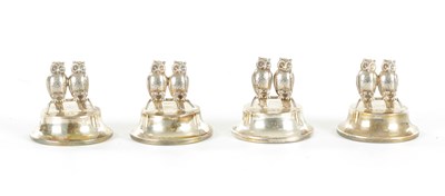 Lot 432 - AN UNUSUAL CASED SET OF FOUR GEORGE V SILVER DOUBLE OWL MENU HOLDERS