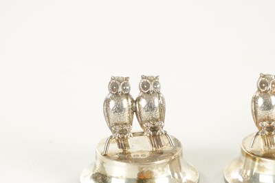 Lot 432 - AN UNUSUAL CASED SET OF FOUR GEORGE V SILVER DOUBLE OWL MENU HOLDERS