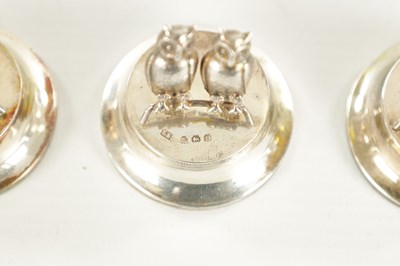 Lot 432 - AN UNUSUAL CASED SET OF FOUR GEORGE V SILVER DOUBLE OWL MENU HOLDERS