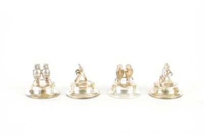 Lot 432 - AN UNUSUAL CASED SET OF FOUR GEORGE V SILVER DOUBLE OWL MENU HOLDERS