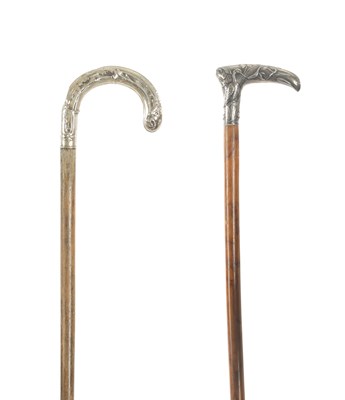 Lot 673 - TWO LATE 19TH CENTURY CONTINENTAL ART NOUVEAU SILVER METAL MOUNTED WALKING STICKS