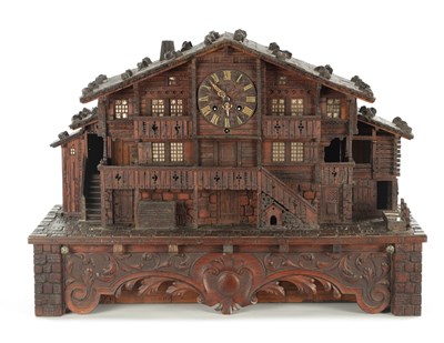 Lot 1208 - A LATE 19TH CENTURY SWISS BLACK FOREST MUSICAL CHALET CLOCK