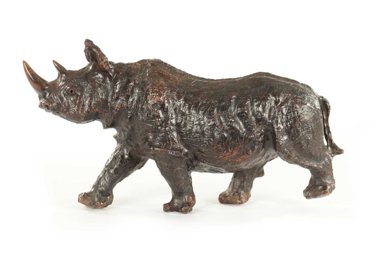 Lot 1320 - A 19TH CENTURY ROOTWOOD CARVING OF A RHINOCEROS