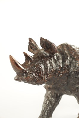 Lot 1320 - A 19TH CENTURY ROOTWOOD CARVING OF A RHINOCEROS