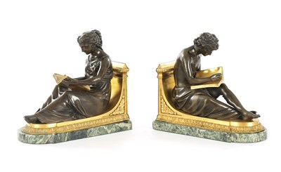 Lot 802 - A PAIR OF 19TH CENTURY FRENCH PATINATED AND GILT BRONZE BOOKENDS