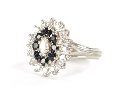 Lot 387 - AN 18CT WHITE GOLD SAPPHIRE AND DIAMOND RING