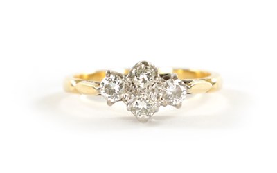 Lot 365 - AN 18CT GOLD FOUR STONE DIAMOND RING