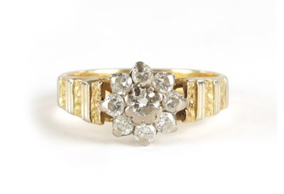 Lot 382 - AN 18CT GOLD NINE STONE DIAMOND CLUSTER RING