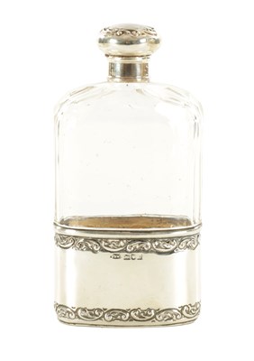 Lot 402 - AN EDWARDIAN SILVER-MOUNTED CUT GLASS HIP FLASK