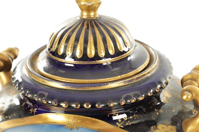 Lot 70 - A PAIR OF LATE 19TH CENTURY ROYAL BLUE AND GILT VIENNA STYLE LIDDED VASES