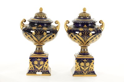 Lot 70 - A PAIR OF LATE 19TH CENTURY ROYAL BLUE AND GILT VIENNA STYLE LIDDED VASES