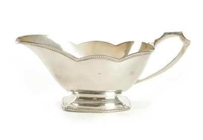 Lot 444 - A GEORGE VI BOXED SILVER SAUCE BOAT