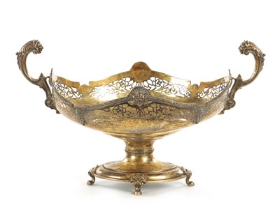 Lot 510 - AN EDWARD VII SILVER GILT TWO-HANDLED BASKET CENTREPIECE