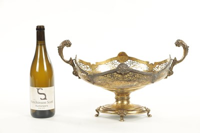 Lot 510 - AN EDWARD VII SILVER GILT TWO-HANDLED BASKET CENTREPIECE