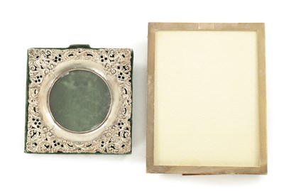 Lot 436 - AN ELIZABETH II PLAIN ENGINE TURNED SILVER PHOTOGRAPH FRAME