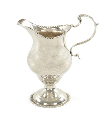 Lot 458 - A GEORGE III SILVER FOOTED CREAM JUG