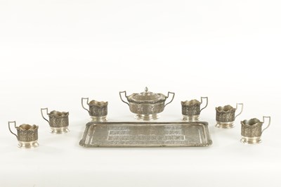 Lot 257 - A LATE 19TH CENTURY SILVER METAL PERSIAN COFFEE SET