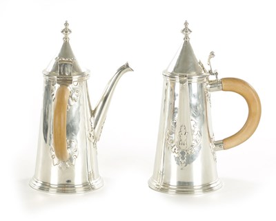 Lot 484 - A PAIR OF GEORGE V SILVER CHOCOLATE POTS