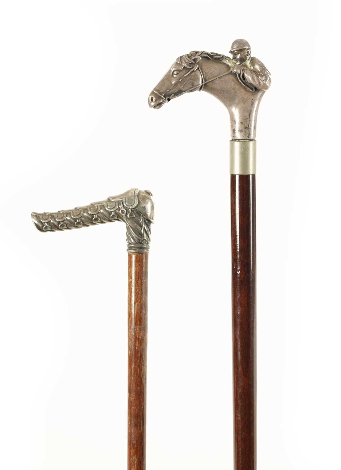 Lot 714 - OF HORSE RACING INTEREST TWO LATE 19TH/EARLY 20TH  CENTURY SILVER-HANDLED WALKING STICKS