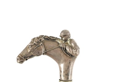 Lot 714 - OF HORSE RACING INTEREST TWO LATE 19TH/EARLY 20TH  CENTURY SILVER-HANDLED WALKING STICKS