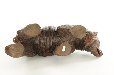 Lot 1337 - A 19TH CENTURY CARVED LINDEN WOOD BLACK FOREST BEAR