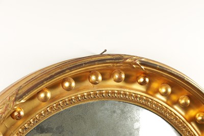 Lot 1378 - A GOOD REGENCY GILT GESSO CIRCULAR CONVEX HANGING MIRROR OF LARGE SIZE
