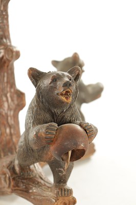 Lot 1310 - A LATE 19TH CENTURY CARVED LINDEN WOOD BLACK FOREST BEAR THREE BRANCH HANGING LIGHT