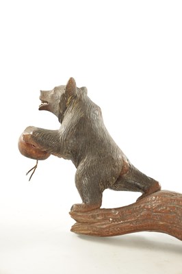 Lot 1310 - A LATE 19TH CENTURY CARVED LINDEN WOOD BLACK FOREST BEAR THREE BRANCH HANGING LIGHT