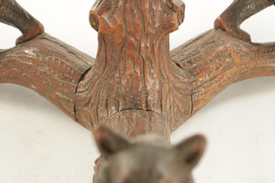Lot 1310 - A LATE 19TH CENTURY CARVED LINDEN WOOD BLACK FOREST BEAR THREE BRANCH HANGING LIGHT