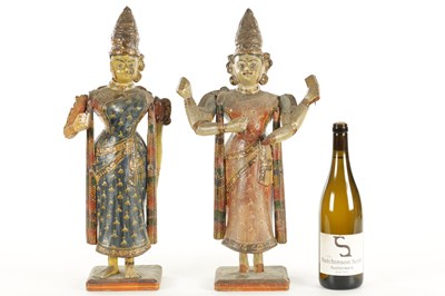 Lot 226 - A PAIR OF 19TH CENTURY POLYCHROME DECORATED INDIAN TEMPLE FIGURES