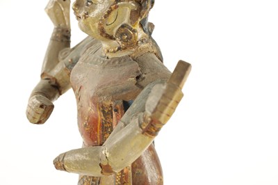 Lot 226 - A PAIR OF 19TH CENTURY POLYCHROME DECORATED INDIAN TEMPLE FIGURES