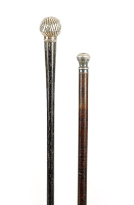 Lot 710 - A SECTIONAL TAPERING LEATHER WALKING CANE